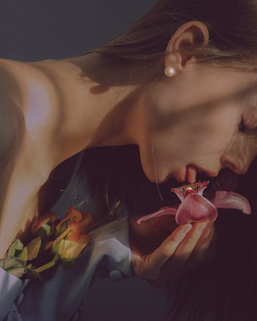 A Painting of a Woman Licking a Flower
