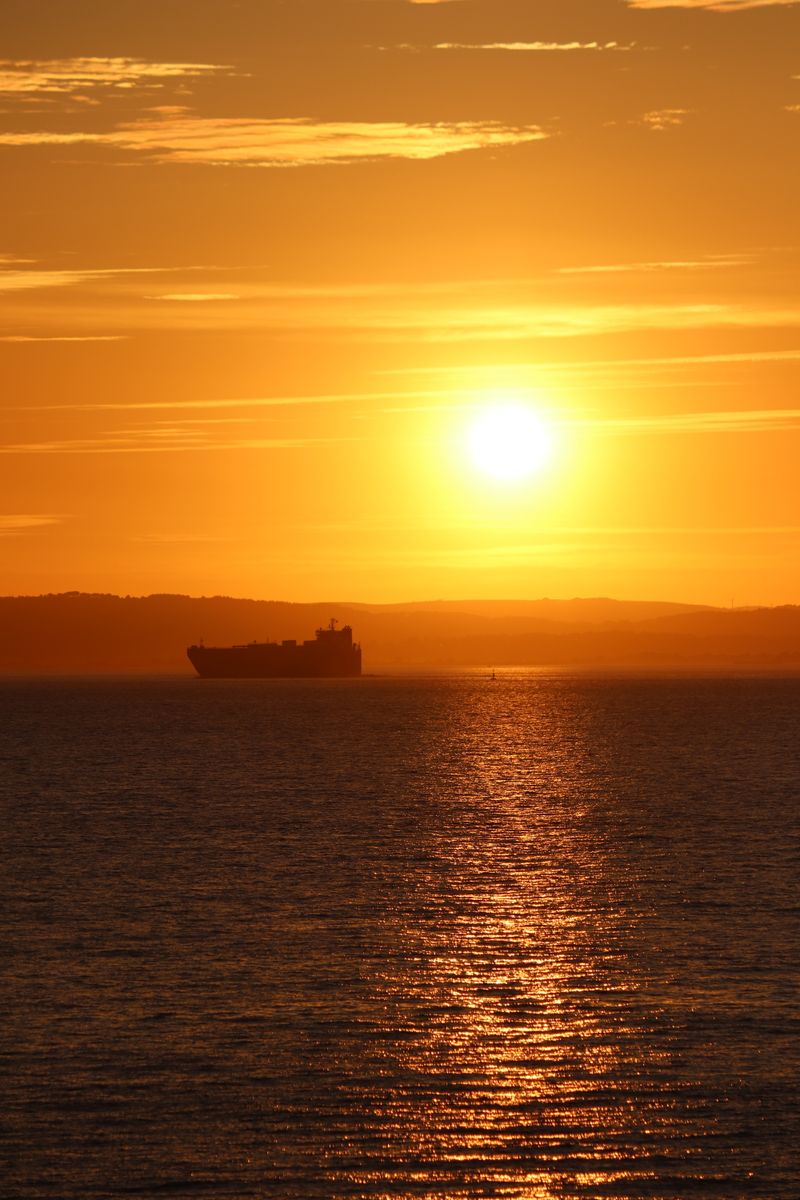 Silhouette of a Ship During Sunset · Free Stock Photo