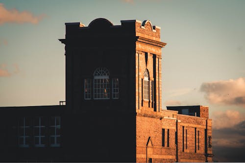 Historic Brick Building against Sunset Sky