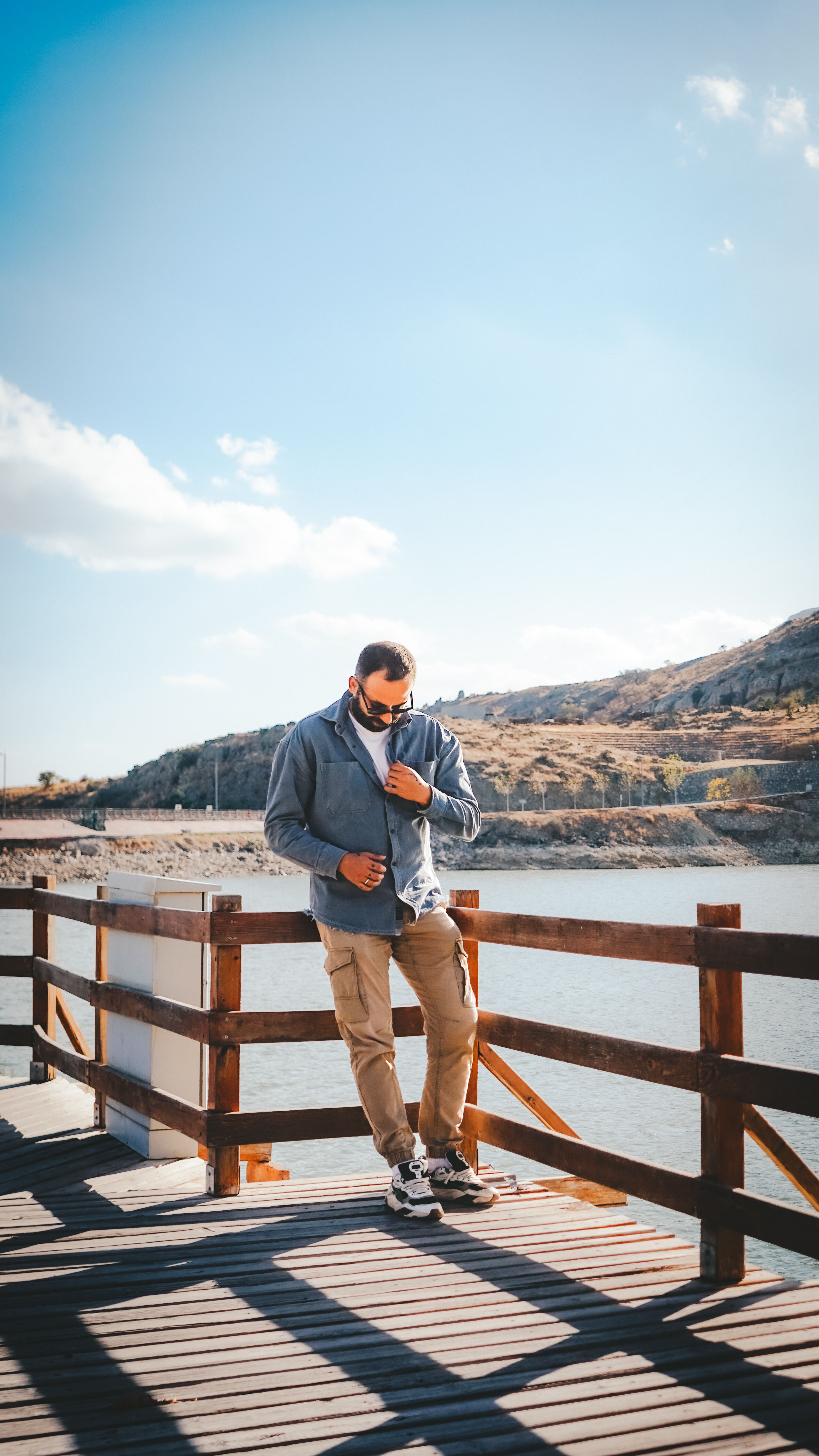Man Leaning Against Concrete Wall · Free Stock Photo