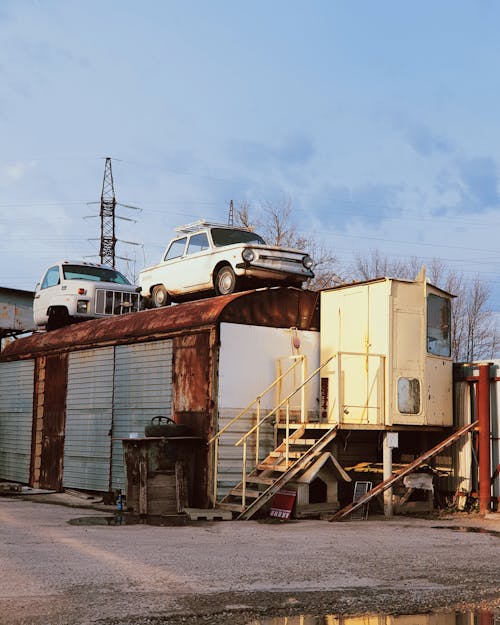 Broken Cars on a Rusty Cargo Container 