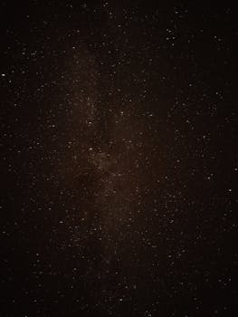 A mesmerizing view of a galaxy and star-filled night sky, ideal for astronomy enthusiasts.