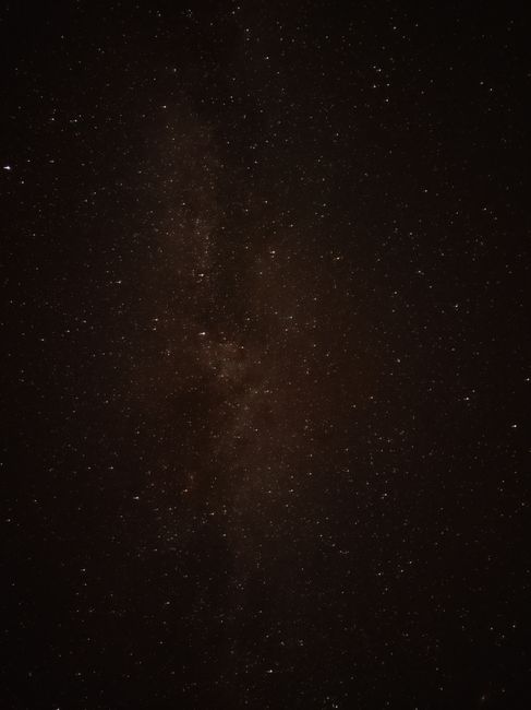 A mesmerizing view of a galaxy and star-filled night sky, ideal for astronomy enthusiasts.