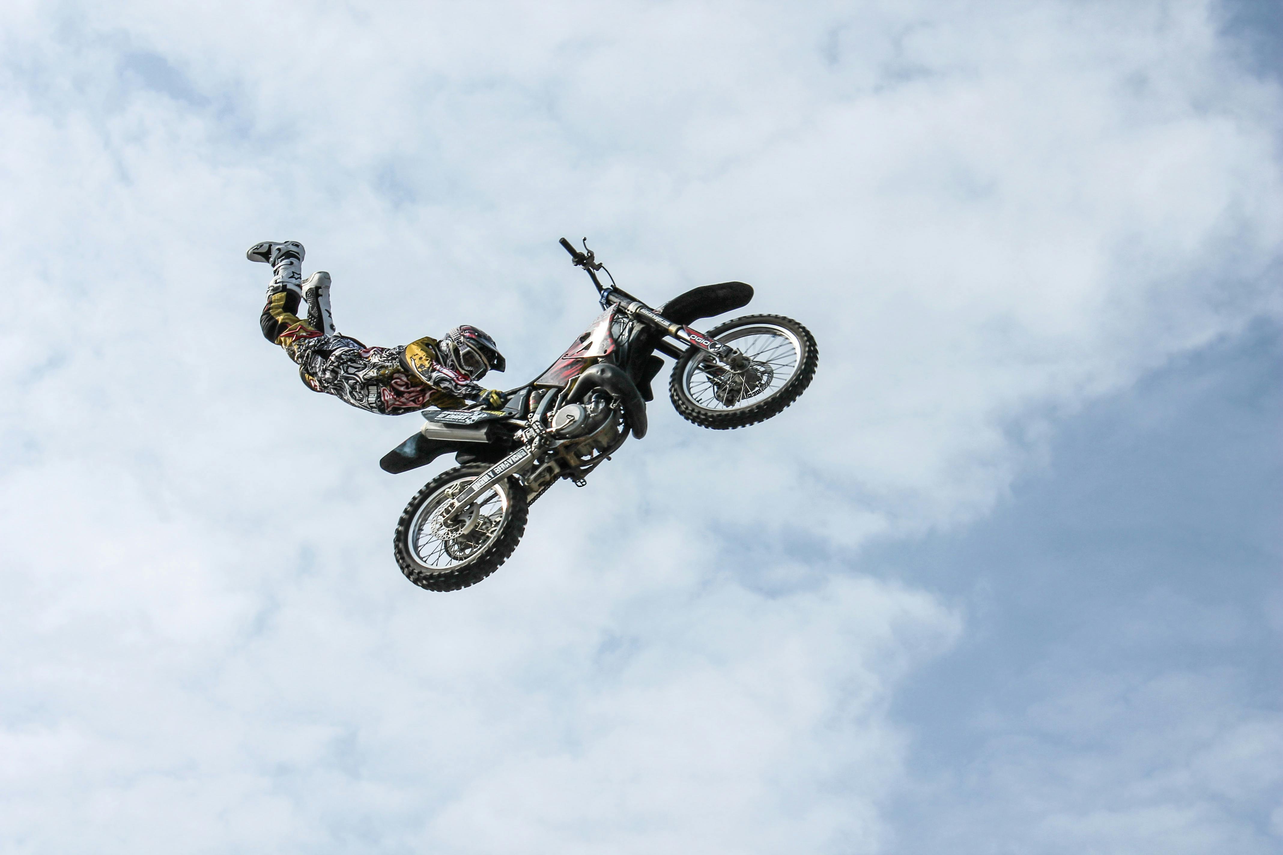 Rider Riding Green Motocross Dirt Bike \u00b7 Free Stock Photo