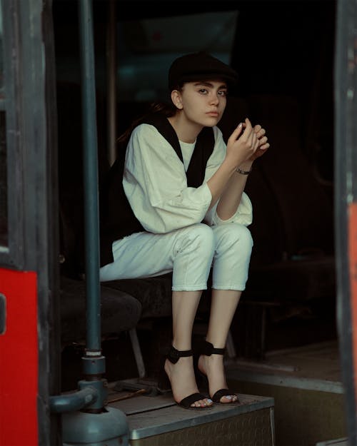 Woman Sitting in White Shirt