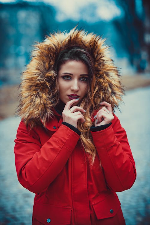 Selective Focus Photography of Woman Wearing Red and Brown Parka Coat ...