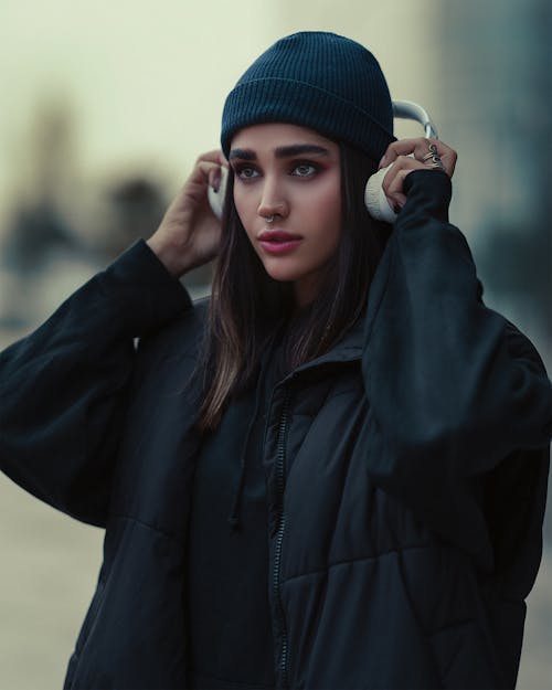 Portrait of Woman in Black Jacket and Headphones