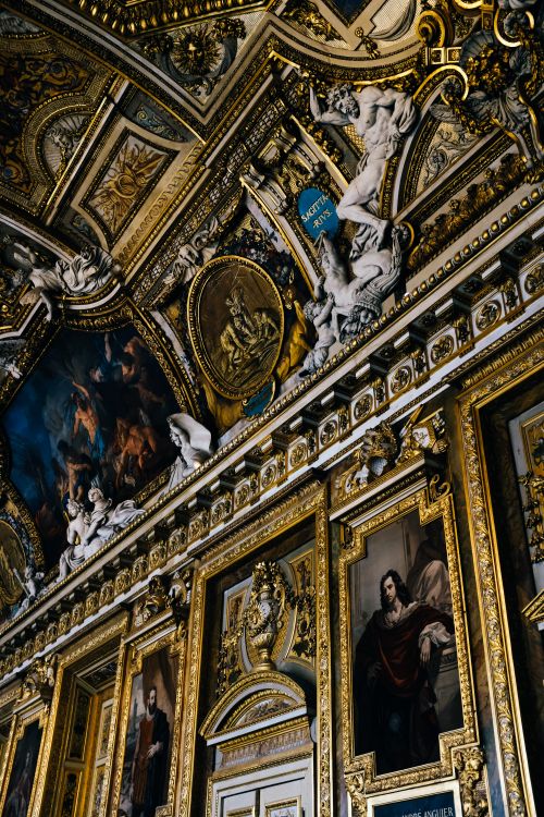 Free Explore the intricate Baroque architecture and lavish decorations of the Louvre Museum's ornate ceiling in Paris. Stock Photo