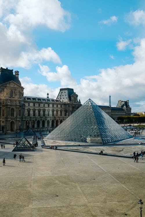Louvre Pyramid in front of the Museum in Paris, France