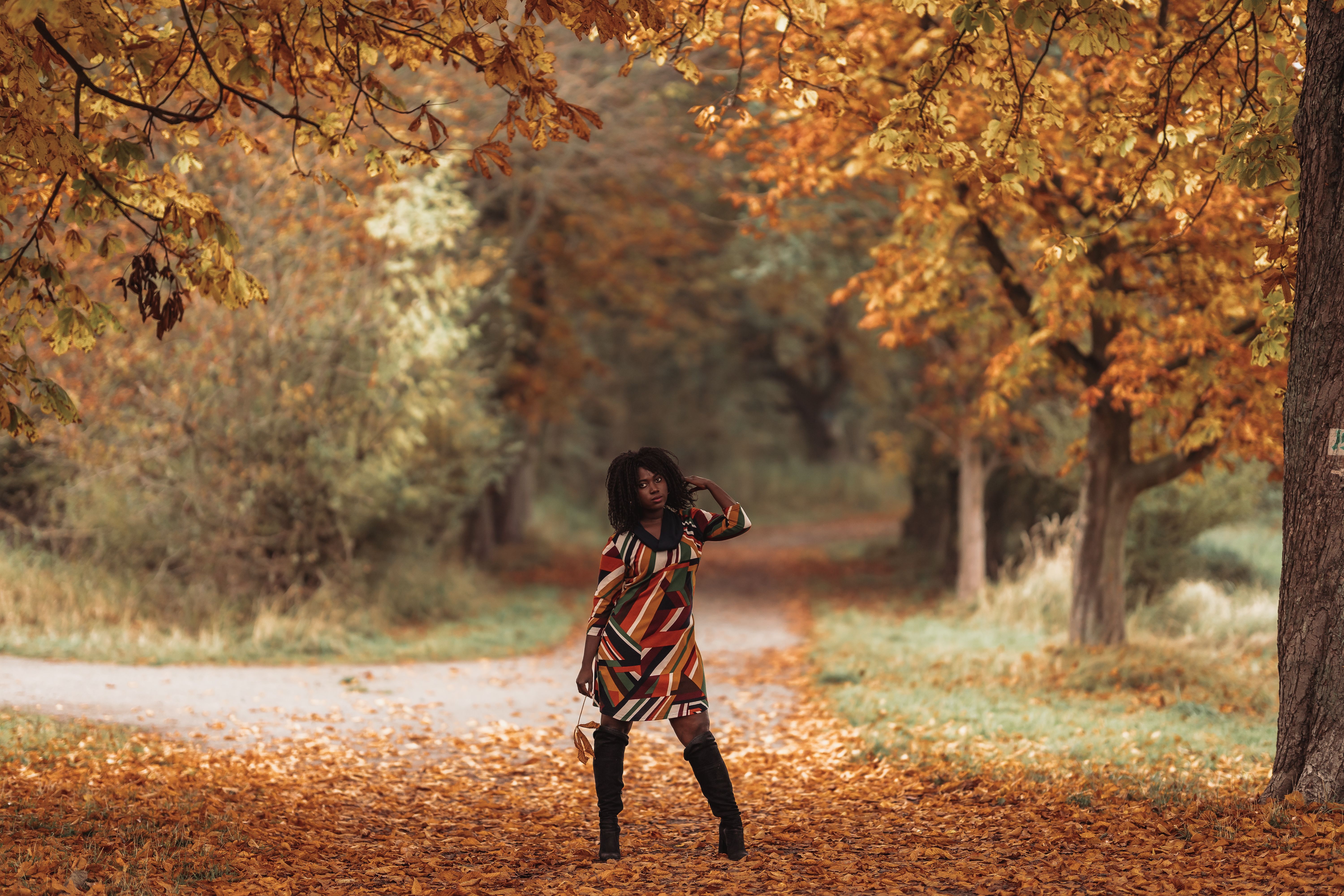 Model in Dress and Boots Posing in Autumn Park · Free Stock Photo