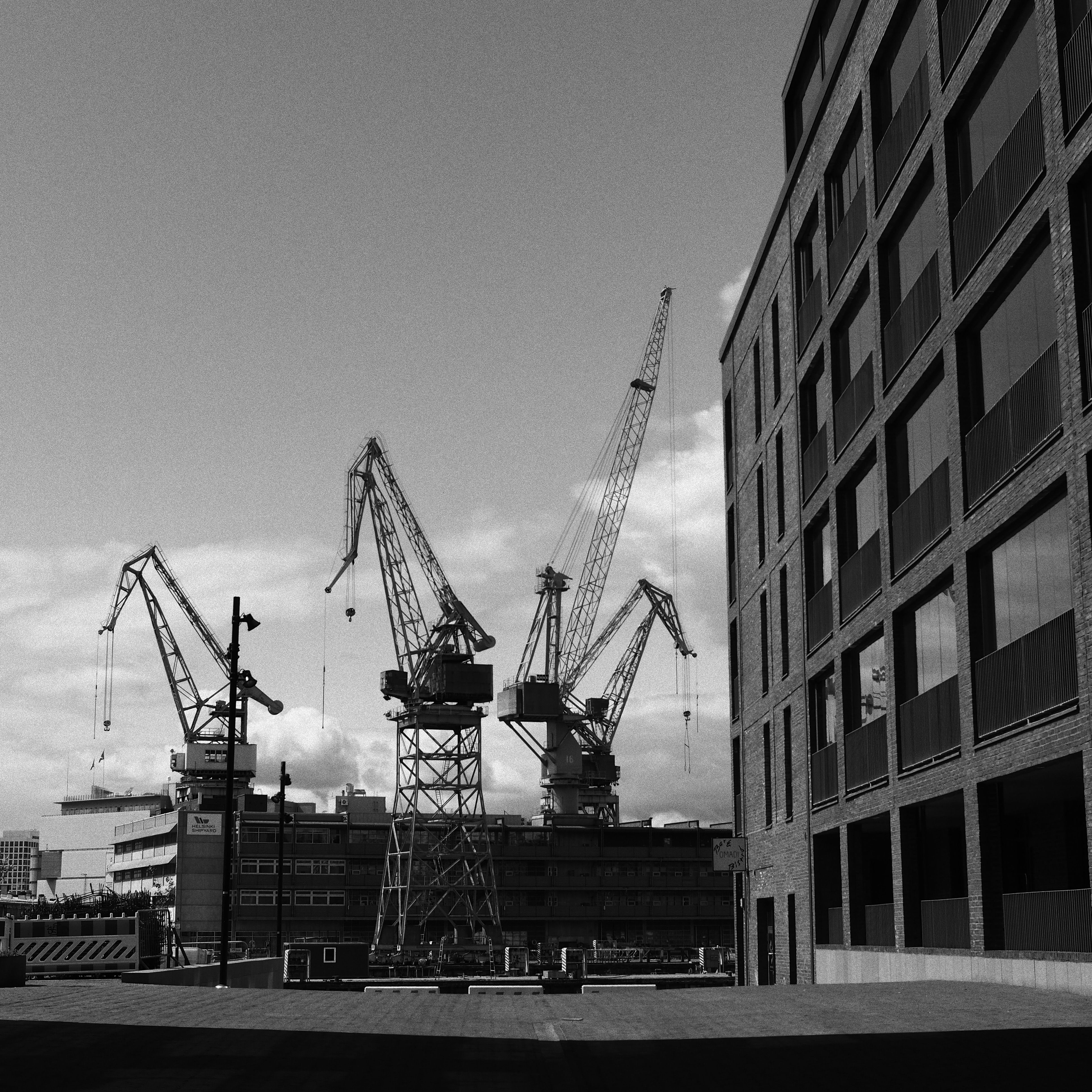 Black and White Photo of Construction Cranes in Port · Free Stock Photo