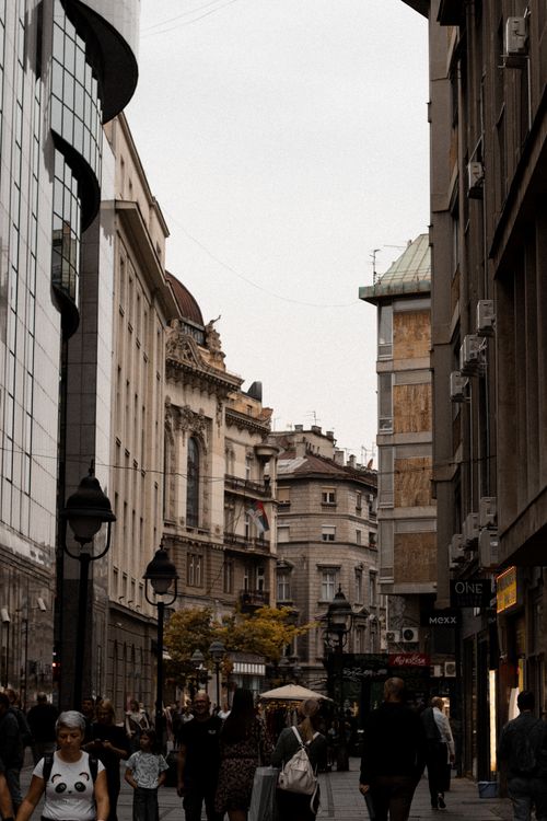 Free Crowded pedestrian street in Belgrade with historic buildings, capturing urban life. Stock Photo