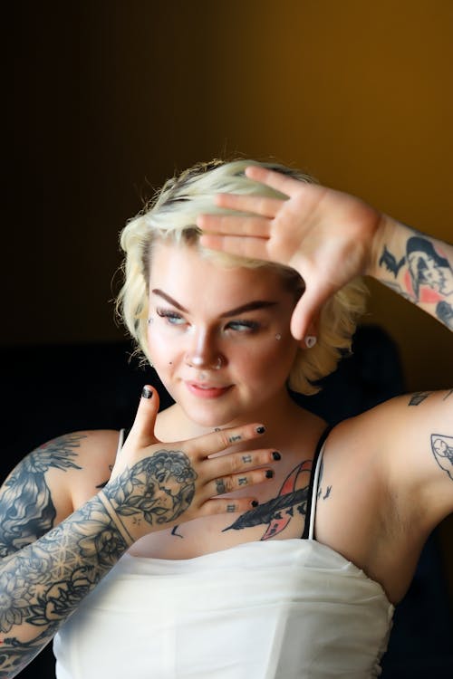 Portrait of a Smiling Young Woman with Tattoos