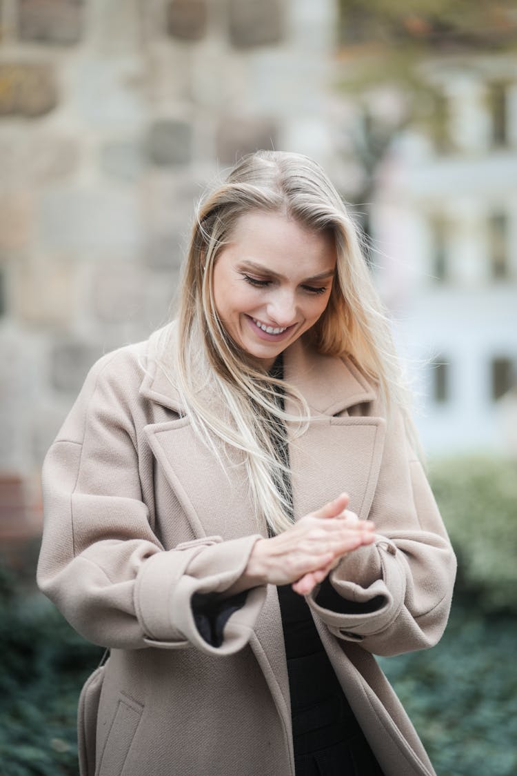 Smiling Blonde Woman In Coat