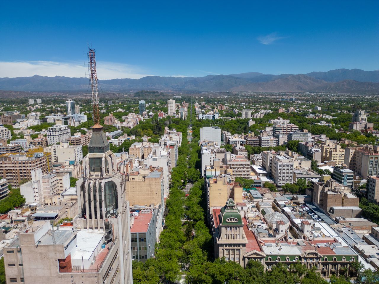 Aerial view of Mendoza cityscape with urban skyline and Andes Mountains in Argentina.