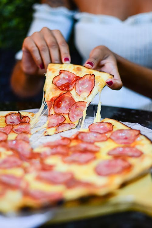 Woman Hands Holding Pizza