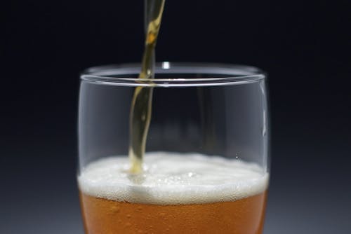 Close-up of Beer Being Poured into a Glass