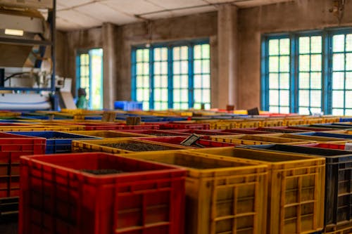 Colorful Plastic Containers in a Warehouse 