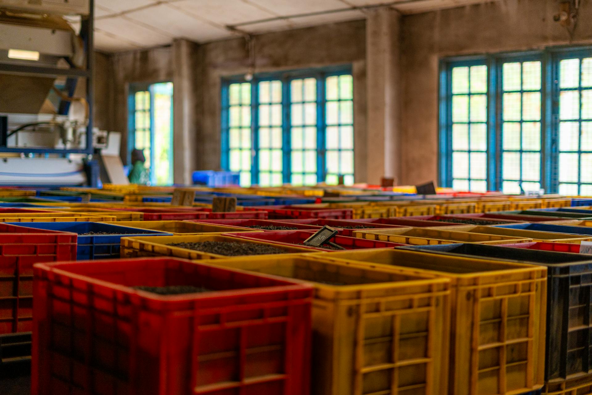 Vibrant plastic crates used for storage and organization in an industrial setting in Ella, Sri Lanka.