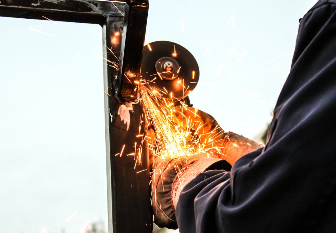 Free Person Holding Angle Grinder Stock Photo