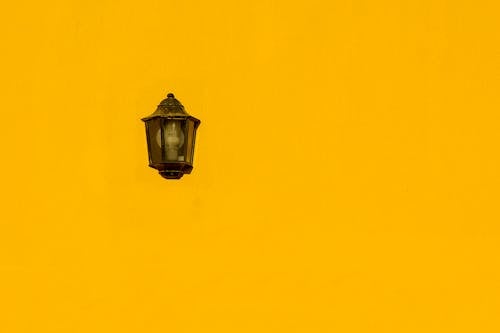 A Vintage Lamp on a Yellow Wall 