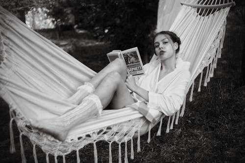 Woman Reading a Book on a Hammock 