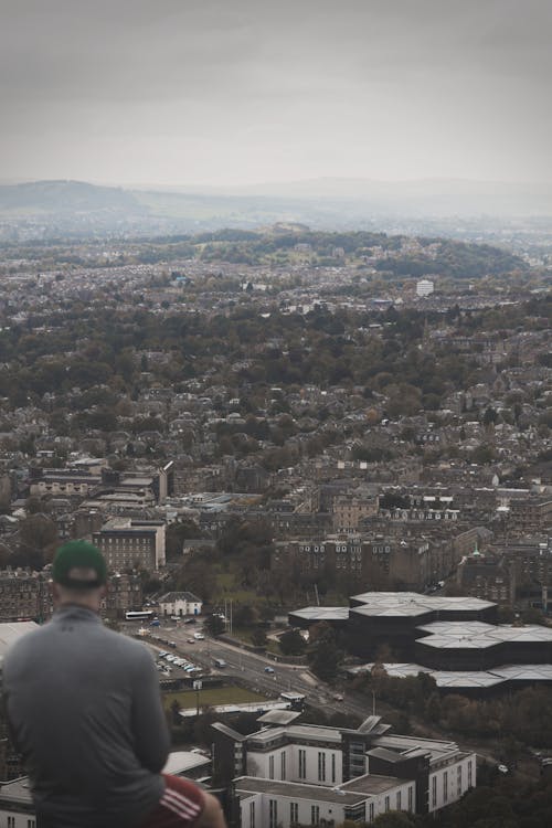 Man Sitting with Edinburgh Cityscape behind