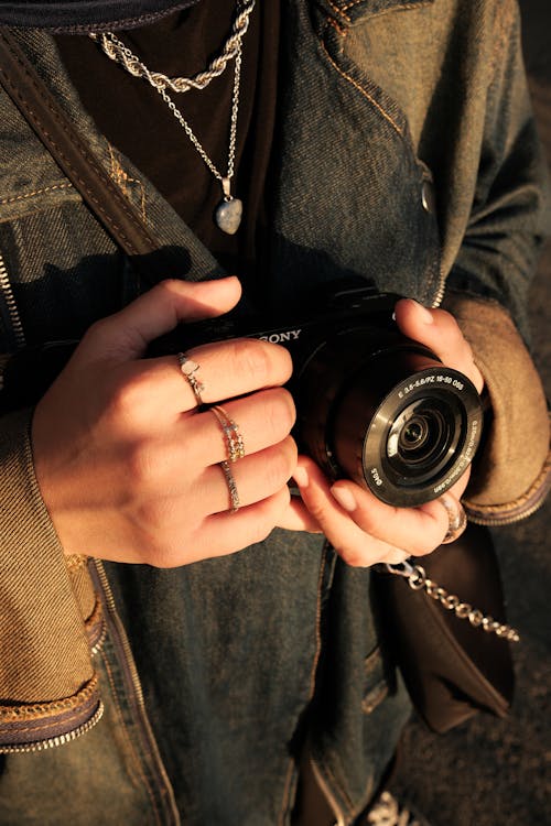 Hands Holding a Digital Camera 