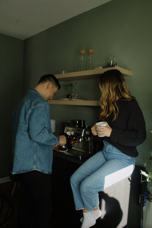 Couple Sitting in a Kitchen