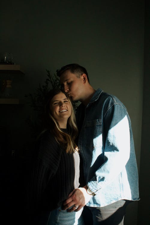 Man Kissing His Wife on the Head