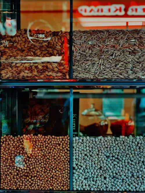 Free A vibrant display of various nuts and seeds in a Bandırma store, showcasing abundance and variety. Stock Photo