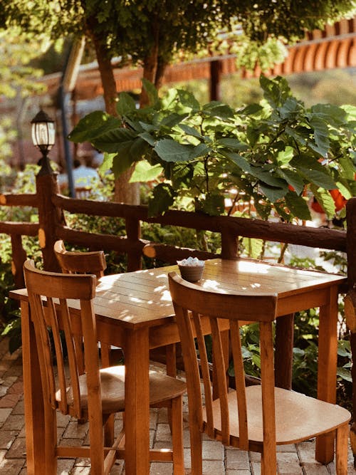 Wooden Table and Chairs on Cafe Patio