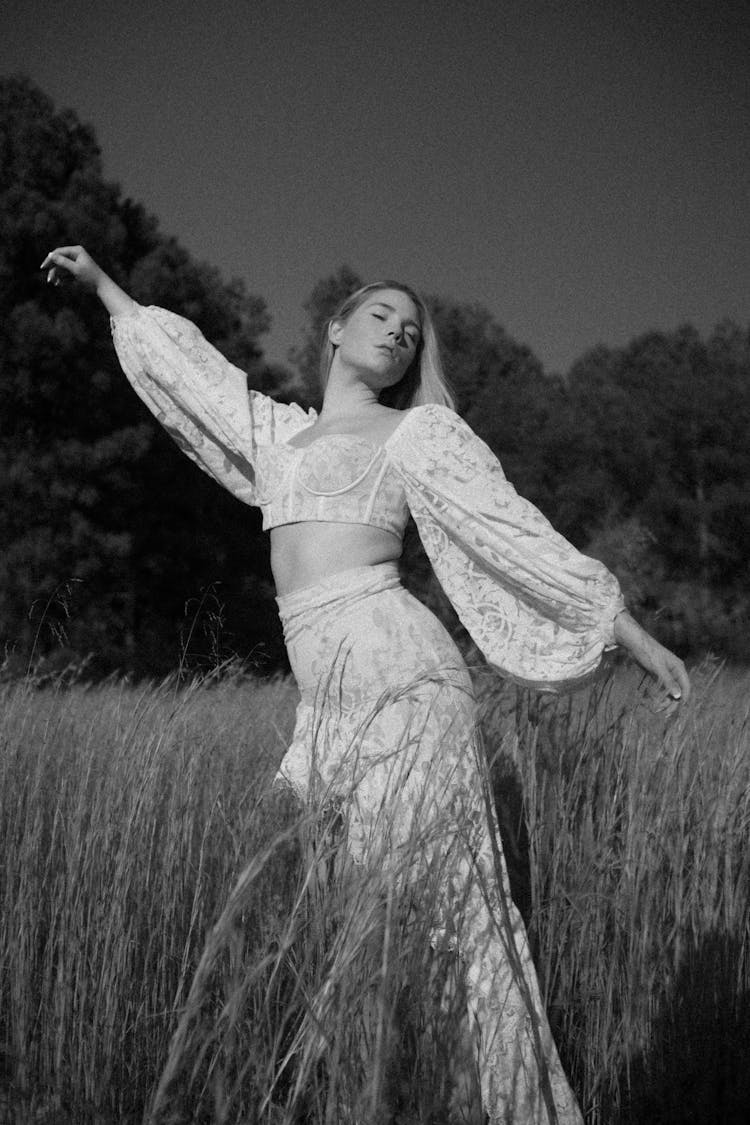 A Woman Dancing In Wheat Field