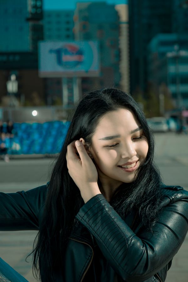 Smiling woman in leather jacket