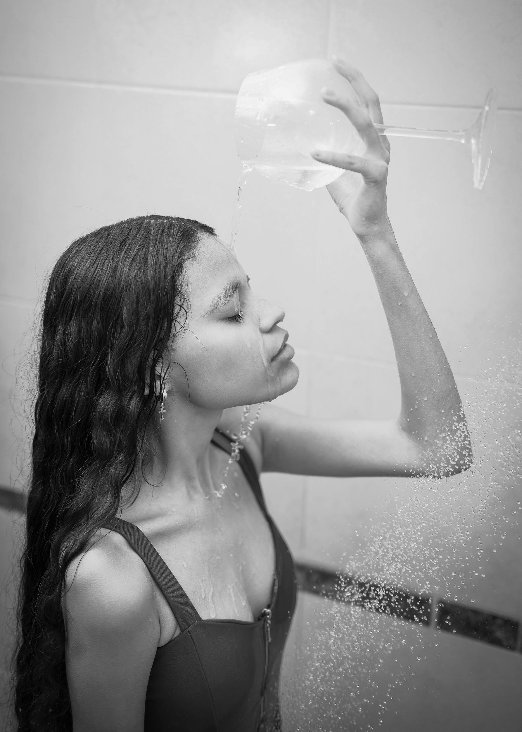 Woman Pouring Water from Glass in Shower · Free Stock Photo