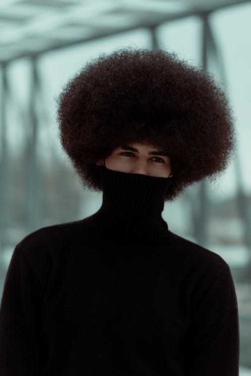 Man with Afro Hairdo Posing in Dark Brown Turtleneck Sweater
