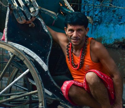 Pulled Rickshaw Driver Waiting for Customers