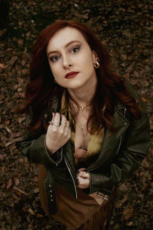 Model in a Leather Jacket and a Brown Leather Skirt in the Autumn Forest