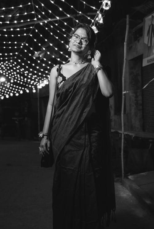 Smiling Woman in Traditional Clothing in Black and White