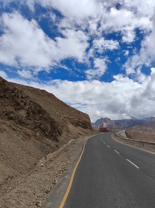 Free Explore the winding roads of Leh's rugged terrain under a vibrant sky. Stock Photo
