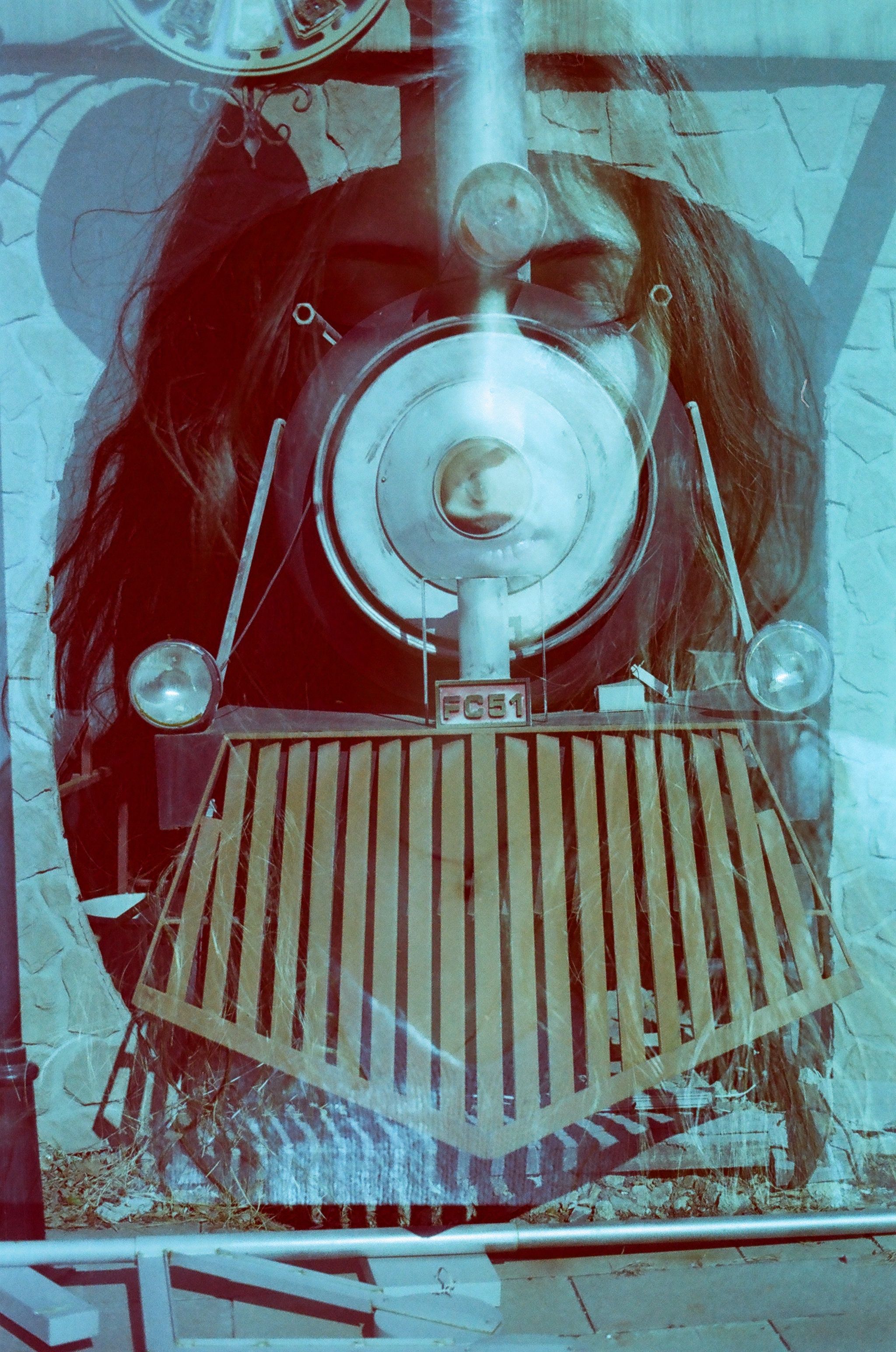 Artistic double exposure of a train and woman's face in Ankara, Türkiye.