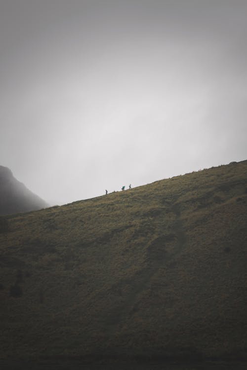 Hikers on Hillside in Scotland