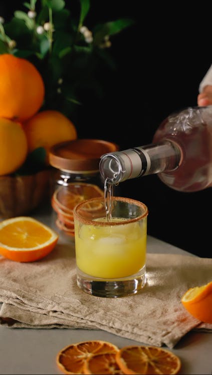 Безкоштовне стокове фото на тему «алкоголь, апельсини, апельсиновий сік»
