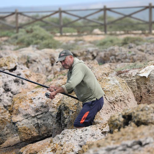 Fotos de stock gratuitas de cerca del mar, pescador