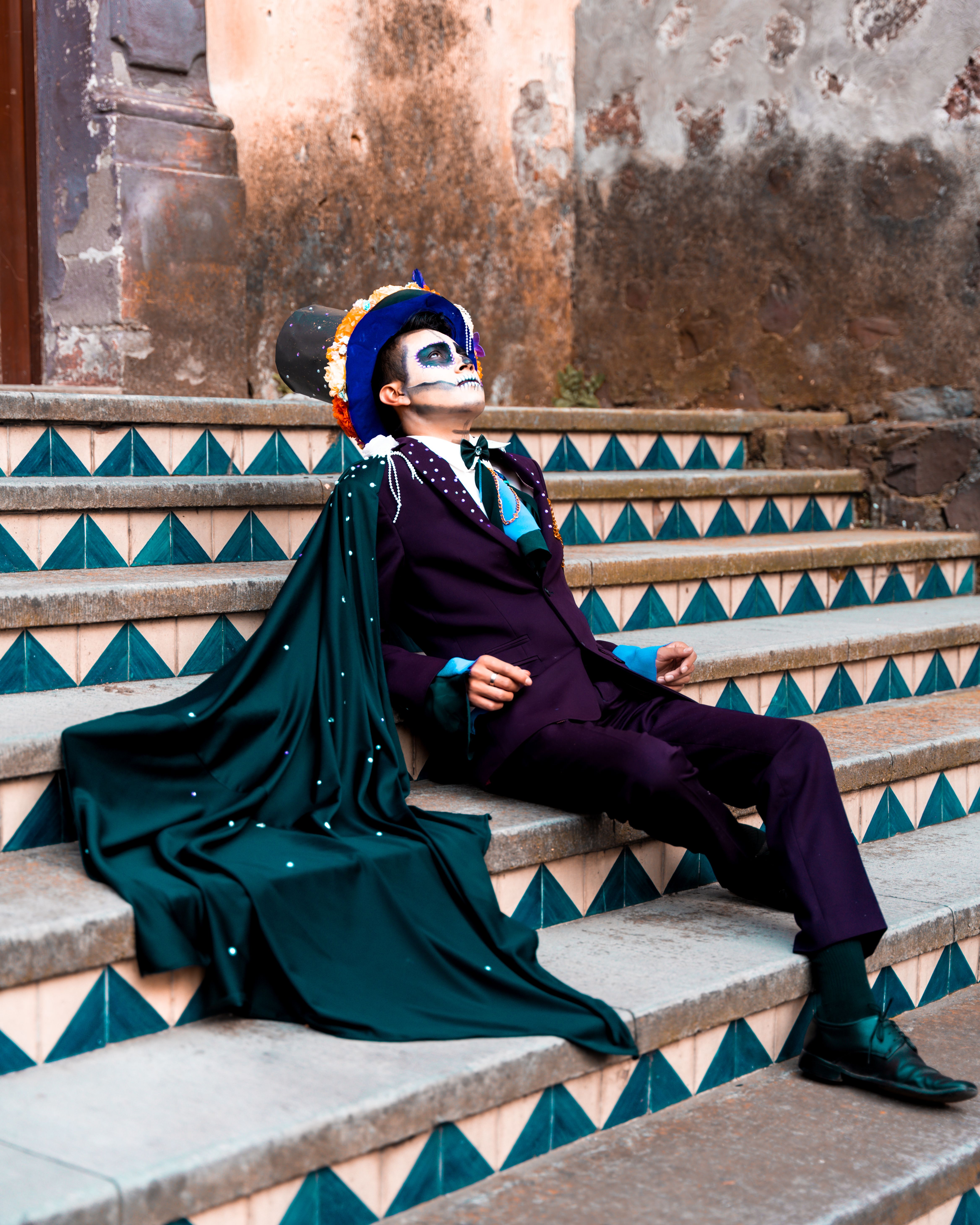 Catrin in a Purple Suit and Green Cape Sitting on the Stairs · Free ...