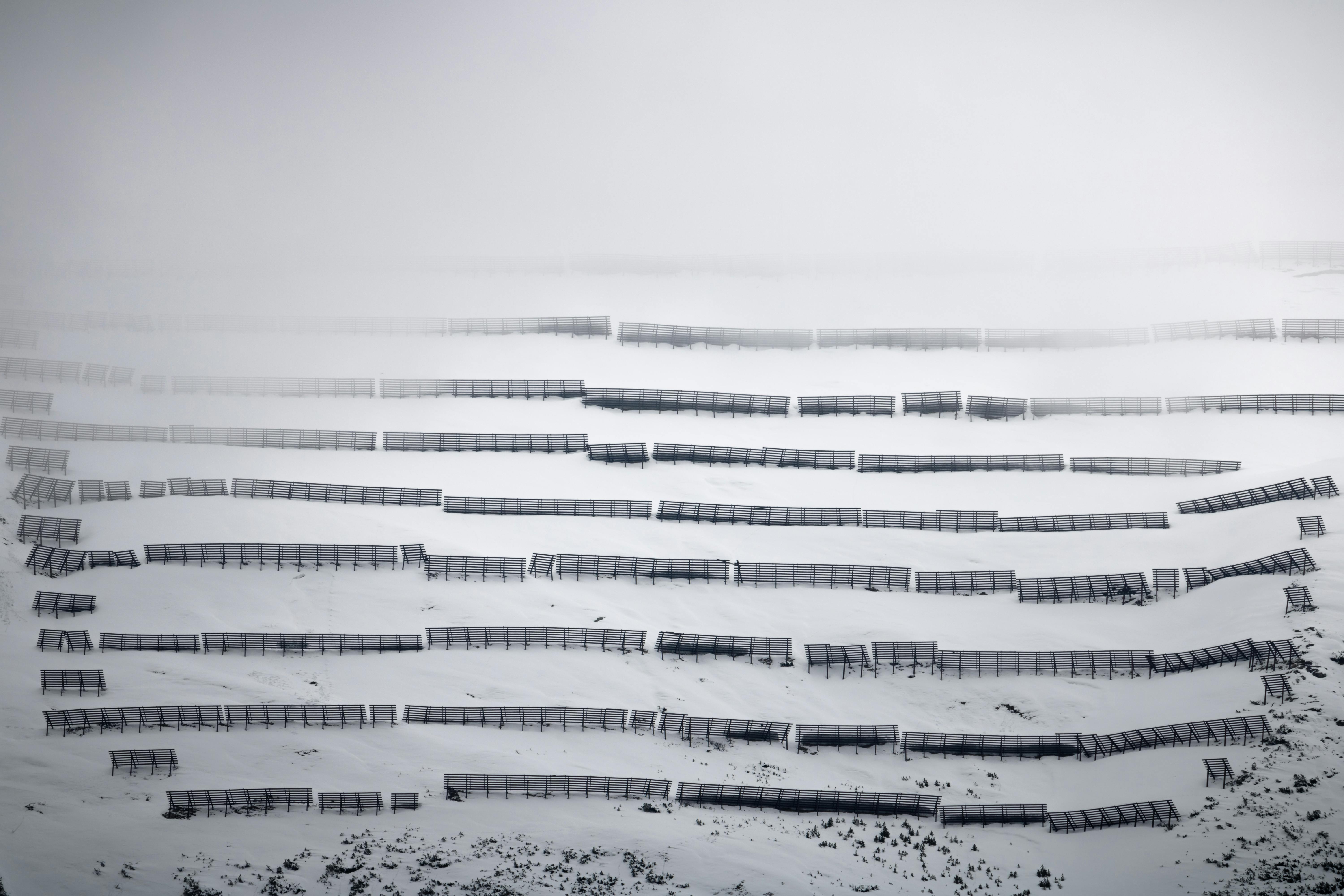 a photo of a fence in the snow