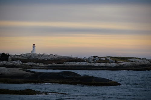 Sea Coast with Lighthouse at Sunset