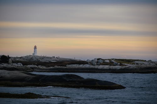 Photos gratuites de bâtiment, côte, coucher de soleil