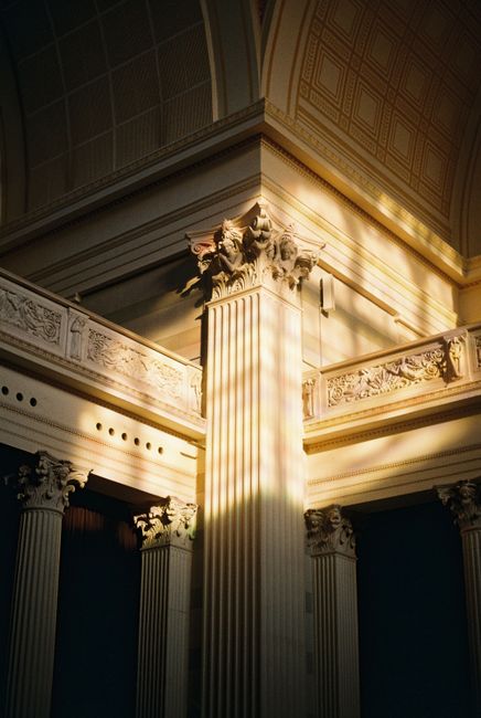 Sunlight illuminates intricate details of a classical column in Potsdam, Germany.