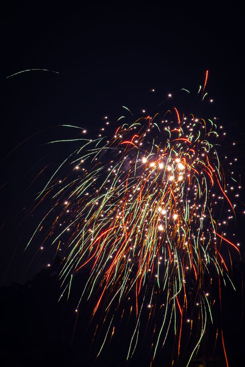 Free Vibrant fireworks exploding in the night sky, illuminating celebrations. Stock Photo